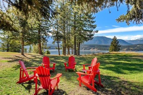 Private backyard oasis with a swing set, outdoor seating and impeccable mountain and lake views.