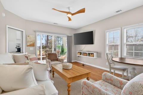 Sun-drenched and airy—relax in coastal comfort with a large Smart TV and private