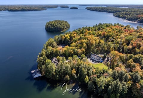 Secluded lakeside retreat surrounded by vibrant autumn foliage
