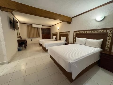 Unwind together in a spacious triple room with cool A/C.