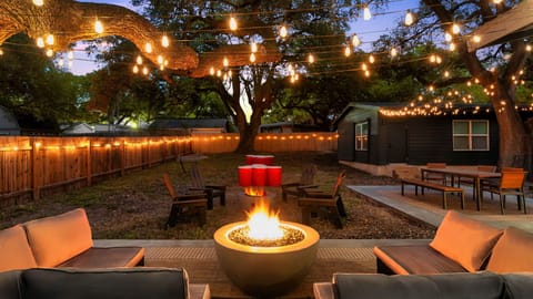 Light up your night with fireside relaxation in our serene outdoor lounge