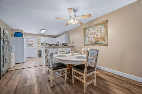 Table with 4 seats and 4 stools at the bar