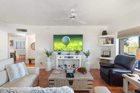 Living room with 75" smart tv.  