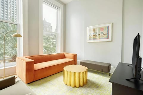 Spacious living room with comfortable seating and a TV.