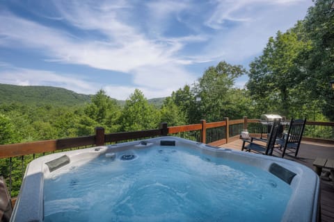 main level deck with mountain views and hot tub