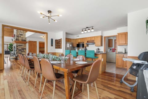 Dining table that seats 12, with 4 barstools in the kitchen, and 6 extra chairs with a fold up table. As well as a rolling high chair.