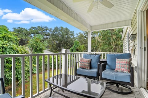 Private Balcony with Treetop Seating - Covered seating gives you an outdoor spot for coffee, reading, or a drink after Pier Village.