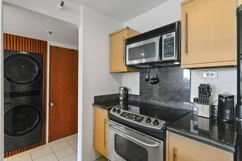 From fresh laundry to fresh meals, this functional kitchen setup makes multitasking feel effortless.