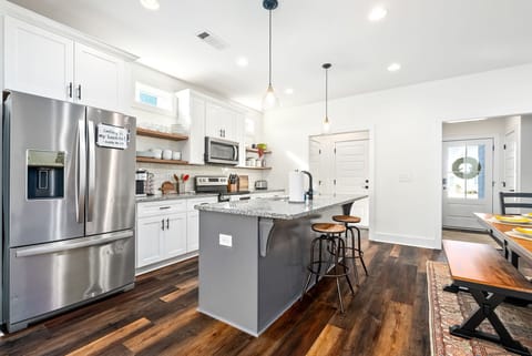 Well stocked kitchen with island seating