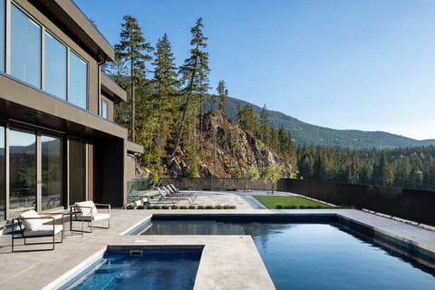 Relax and unwind in the heated pool, offering a refreshing escape with stunning mountain views, available in the summer months.