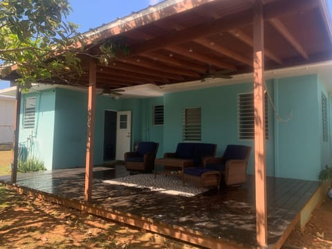 A spacious covered patio with cozy seating perfect for relaxing outdoors 