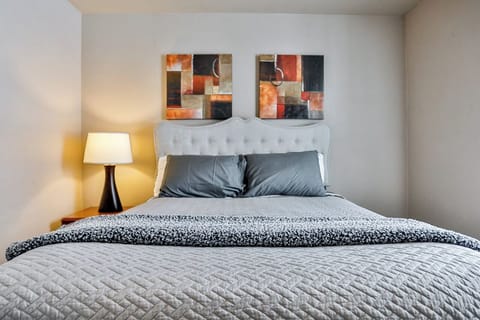Thoughtfully styled bedroom with a plush bed, neutral palette, and warm lighting for a relaxing night’s sleep.