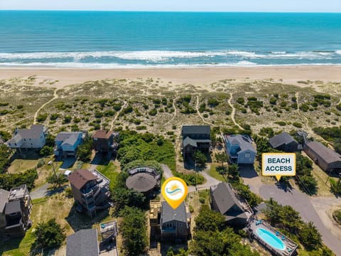 Steps from the beach, this 4BR, 2BA retreat offers ocean-to-sound views, spacious decks, and some of the clearest night skies on Hatteras Island.