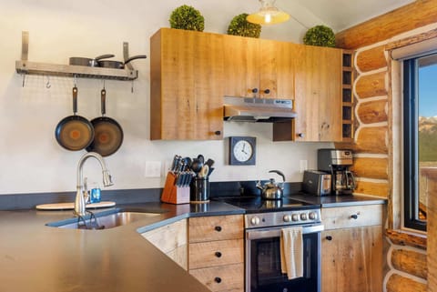 Kitchen: Drip coffee maker, toaster, cooking utensils, tableware