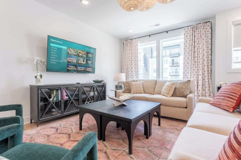 Explore this stylish Nashville retreat, combining modern design and cozy comfort. Perfect for large groups, the inviting living area is ideal for game nights or movie marathons. Enjoy luxury close to downtown attractions. Book your getaway today!