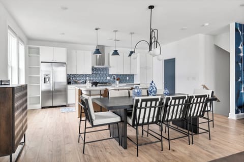 Discover this stylish dining area in Downtown Nashville, ideal for large gatherings. With chic decor and spacious design, it's perfect for bachelorette parties or family reunions. Enjoy modern elegance and create unforgettable memories!