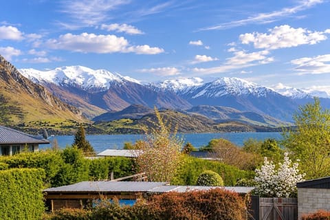 Wake up to breathtaking views of the snow-capped mountains and shimmering lake right from your doorstep.