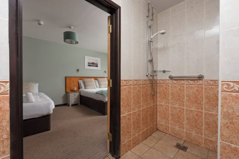 Family Quadruple Room, Private Bathroom, Ground Floor | Bathroom | Shower, hair dryer, towels, soap
