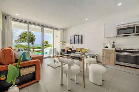 Relax in your bright, modern space where floor-to-ceiling windows frame stunning ocean views. Cook in your sleek kitchen and dine while watching palm trees sway.