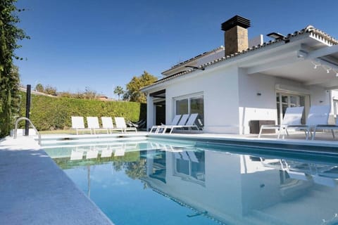 Spacious Villa with private HEATED pool, sun loungers and shaded outdoor seating. Designed for relaxation and style - enjoy sunny days, evening swims in lush warm water and tranquil views in complete privacy.