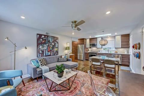 Every detail, from the vibrant area rug to the modern fixtures, is designed to enhance your comfort.