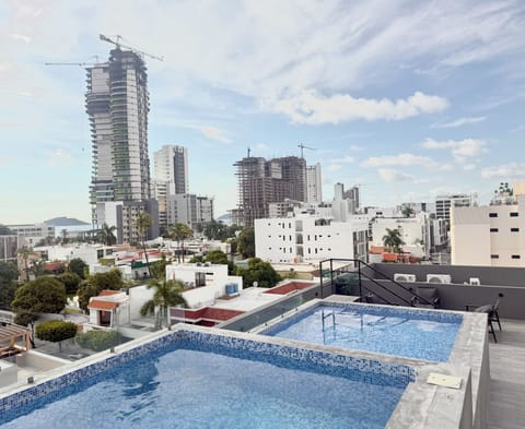 Family Room, Balcony, City View | City view