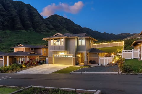 Evening exterior with warm lights and scenic mountain backdrop!