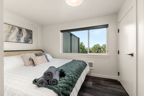 - Bedroom with king bed, forest views, and modern bedding   - Calming tones and cozy linens for a perfect sleep environment   - Ideal for couples or solo travelers seeking rest and style