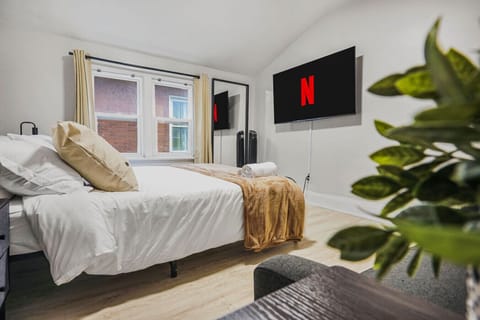 Stream your favorite shows from the comfort of this plush queen bed. Whether you are winding down after a busy day or enjoying a slow morning, this cozy retreat offers the perfect setup for ultimate relaxation and style.