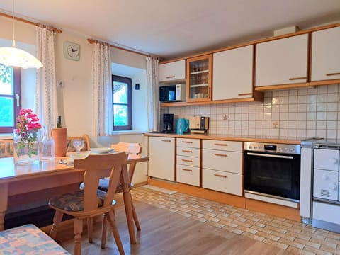 Furniture, Interior Design, Flooring, Wood, Countertop, Kitchen, Floor, Cabinetry, Room, Ceiling