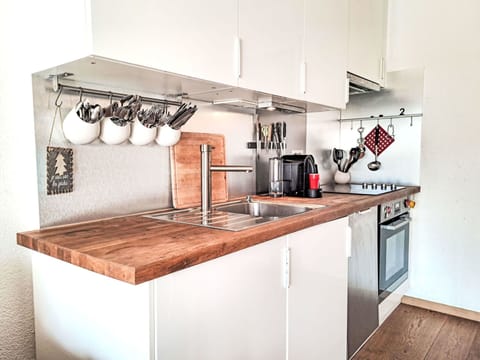 Kitchen, Countertop, Kitchen Appliance, Cabinetry, Wood, Major Appliance, Interior Design, Flooring, Plumbing Fixture, Home Appliance