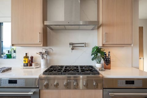 A home chef’s playground: dual ovens, six burners, and a hot water tap for effortless cooking.
