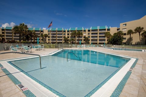 Take a dip in this sparkling oceanfront pool surrounded by palm trees and coastal breezes—perfect for relaxing after a day on the sand during your unforgettable beach stay.