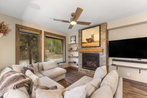 Sink into plush seating by the crackling fireplace while enjoying forest views through your windows.