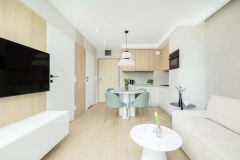 Stylish interior that connects living, dining, and kitchen areas in one harmonious space. Ideal for relaxing or entertaining guests.