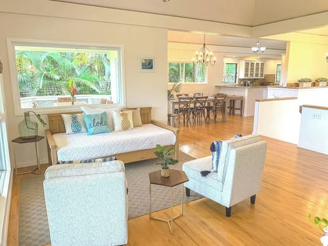 Relax with family or friends in the spacious, open-concept living room with A/C and high ceilings