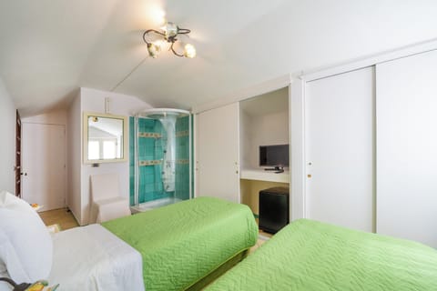 Standard Quadruple Room, Patio, Sea View | Frette Italian sheets, premium bedding, down comforters