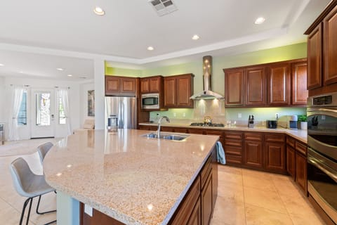 Spacious, well stocked kitchen plus work island