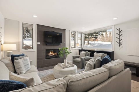 The tranquil color palette, comfortable furnishings, gas fireplace and flat screen TV with great natural light create a relaxing space to unwind.