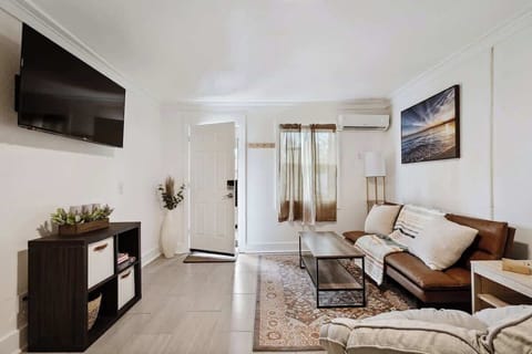 Chic living room w/ sofa seating, wall art & open layout that feels bright and inviting