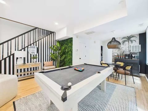 Game Room: Enjoy friendly competition with a pool table and stylish lounge area!