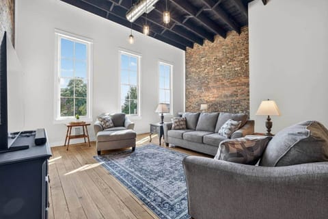 Relax in this spacious living room with a view of the historic downtown square.