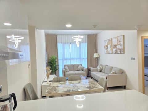 Luxury Apartment, Balcony, City View | Living area | 65-inch Smart TV with digital channels, streaming services