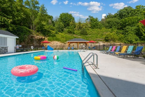 Outdoor seasonal pool, nestled in a cove of trees.