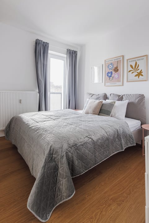 Bright, cozy bedroom with plush bedding and peaceful vibes