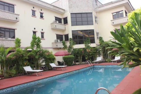 Outdoor pool, open 7:00 AM to 7:00 PM, pool umbrellas, sun loungers