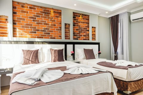 Family Quadruple Room, City View | In-room safe, soundproofing, free WiFi