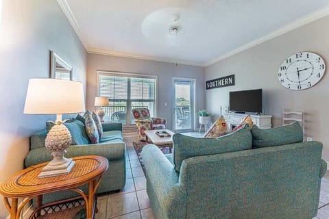 Relax in this bright living room with comfortable seating and natural light.
