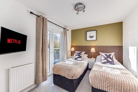 Bedroom one features a comfortable zip and link bed, set up as two single beds by default but can be joined to form a king-size bed upon request.