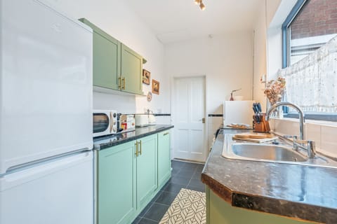 Cook with ease in the fully equipped kitchen, complete with all the cookware, utensils, and appliances you need for a home-cooked meal.